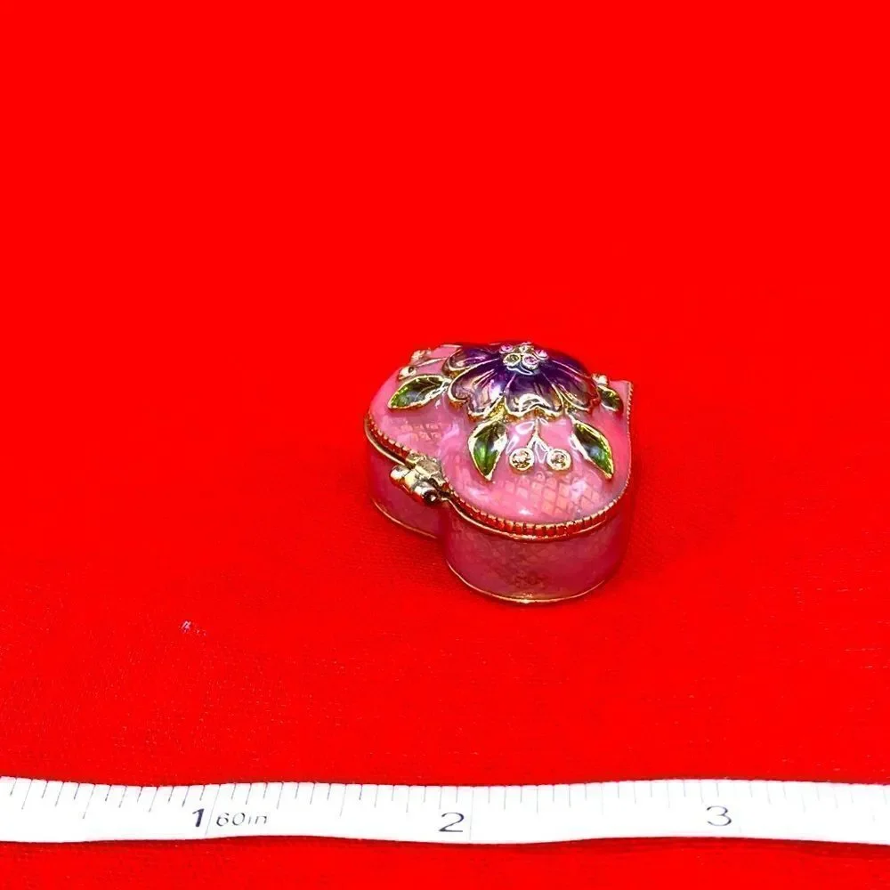Small heart shaped trinket box marked Monet 2006 on the bottom